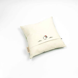 Fluffikon silk square pillow made from green moroccan fabric. The pillow is shown from the back. Size 45x45 cm.