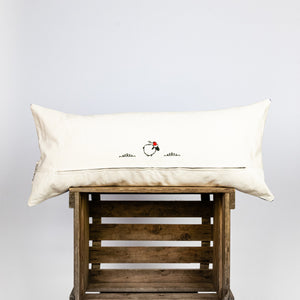 Blue-white decorative lumbar pillow made from silk with moroccan pattern. Back of the throw pillow made from cotton. Pillow on wooden box.