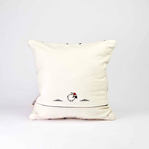 The back of a square Fluffikon Kilim pillow cover. The pillows stands in front of a white background.