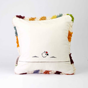 Ein Fluffikon Kinderzimmer Kissen vor weissem Hintergrund. Das Kissen ist von hinten gezeigt.