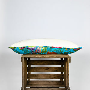 Blue decorative lumbar pillow made from shiny brocade with colourful flowers embroidery.