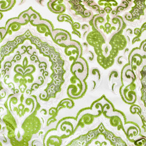 Zoom on Green Beige Sofa Pillow on a wooden box.