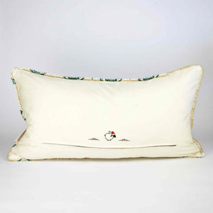 Oversize Fluffikon throw pillow in front of white background. The pillow is shown from the back standing on the ground.