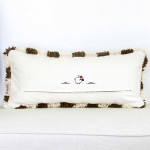 Back view on a brown checkered Fluffikon lumbar pillow. The Berber was made from Beni Ourain wool rug.