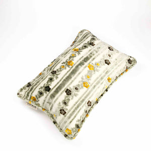 Large decorative pillow made from grey velvet fabric. The Fluffikon pillow is placed on a white background.