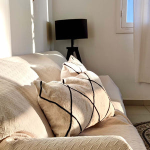 Two Kilim pillow covers during sunset light.