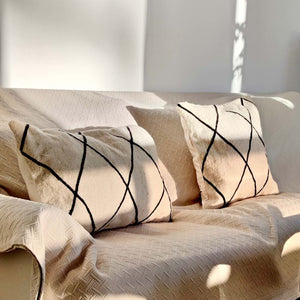 Two Kilim pillow covers during sunset light.