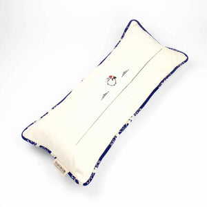 Blue velvet couch pillow with piped edges.