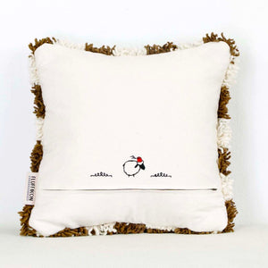 The back view of a brown checkered Moroccan Berber pillow in front of a white background.