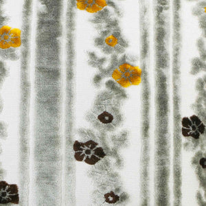 Zoom on the pattern of grey moroccan velvet fabric with yellow flowers.