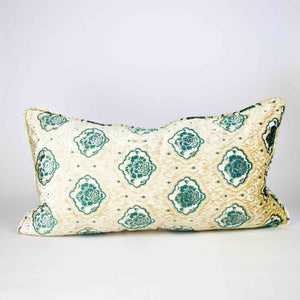 Oversize Fluffikon throw pillow in front of white background. The pillow is standing on the ground.