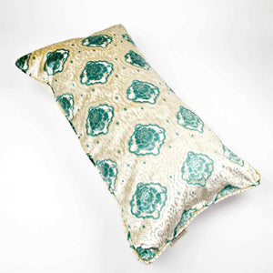 Oversize Fluffikon throw pillow in front of white background. The pillow is laying on the ground.