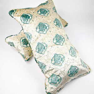 Oversize Fluffikon throw pillow. The pillow is laying on another lumbar pillow..