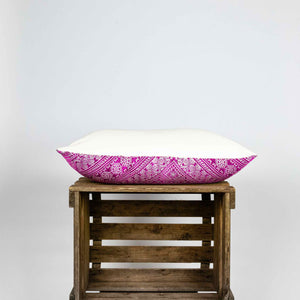 Fluffikon silk rectangular decorative pillow. The throw pillow is made from pink-white moroccan fabric shown from the side.