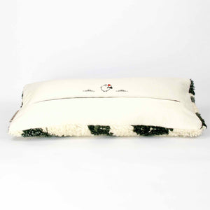 Side view of a vintage rug pillow.