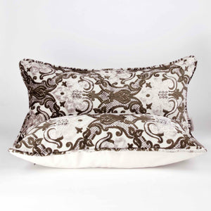 Two large couch pillows made from brown beige velvet fabric.