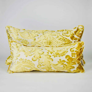 Two Fluffikon oversized couch pillows made from gold velvet fabric. They have an traditional moroccan / oriental look.