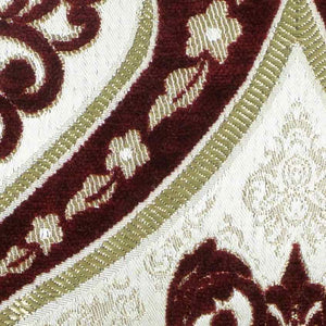 Zoom on burgundy gold velvet fabric.