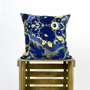 Velvet blue yellow throw pillow.