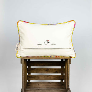 Back of yellow Brocade pillow on wooden box. Size 40x60 cm.