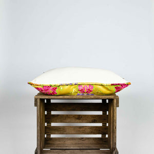 Side of yellow Brocade pillow on wooden box. Size 40x60 cm.