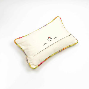 Back of yellow Brocade pillow on the ground. Size 40x60 cm.