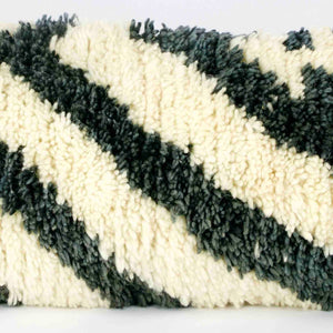 Zoom on wool of a vintage rug pillow.