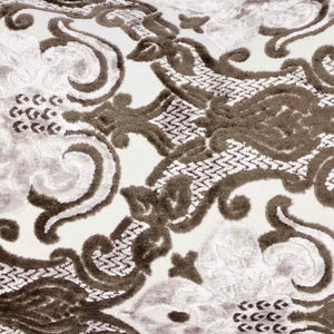 Zoom on large couch pillow with brown beige velvet.