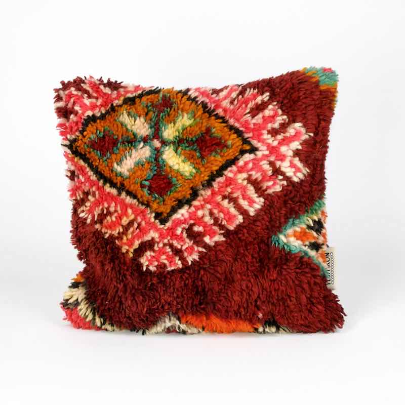 Square Berber pillow made from a red Moroccan rug.