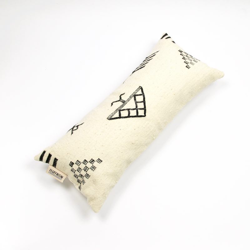 Fluffikon Kilim pillow on a white background.