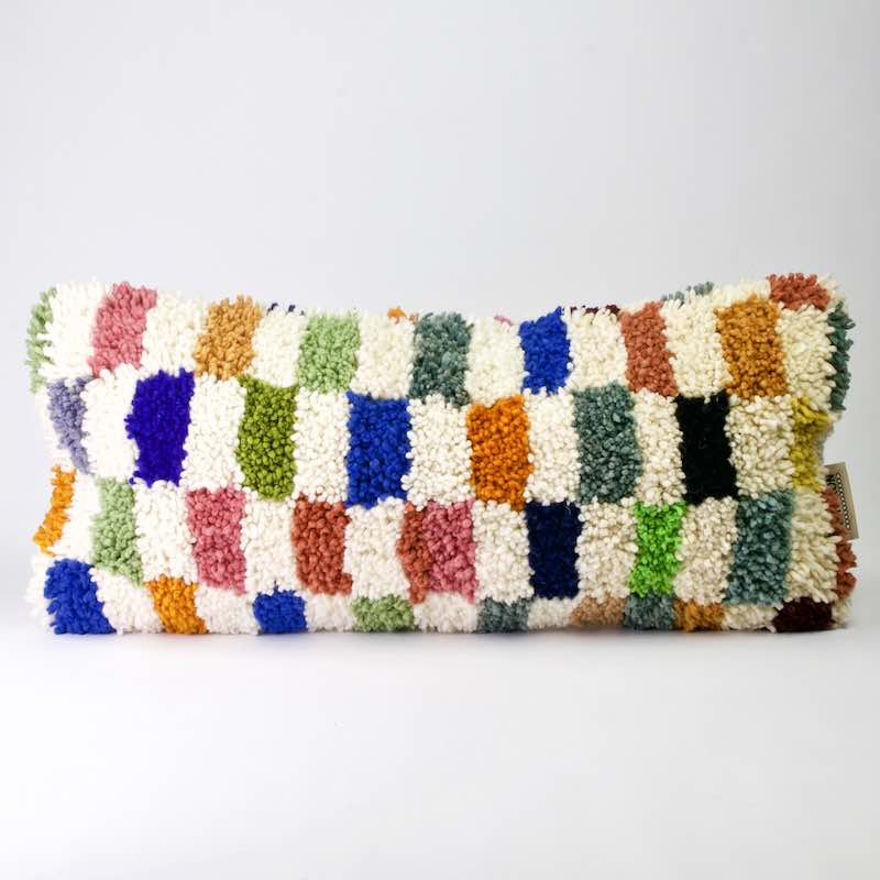 Colorful Fluffikon lumbar pillow. The pillow size is 35x70 cm.