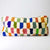 Colorful Fluffikon lumbar pillow. The pillow size is 35x70 cm.