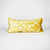 Gold Fluffikon sofa cushion standing in front of white background.