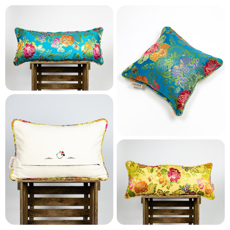 Four Fluffikon decorative moroccan throw pillows. Blue brocade lumbar pillow, blue square brocade pillow, white rectangular brocade pillow and lumbar yellow brocade pillow. 