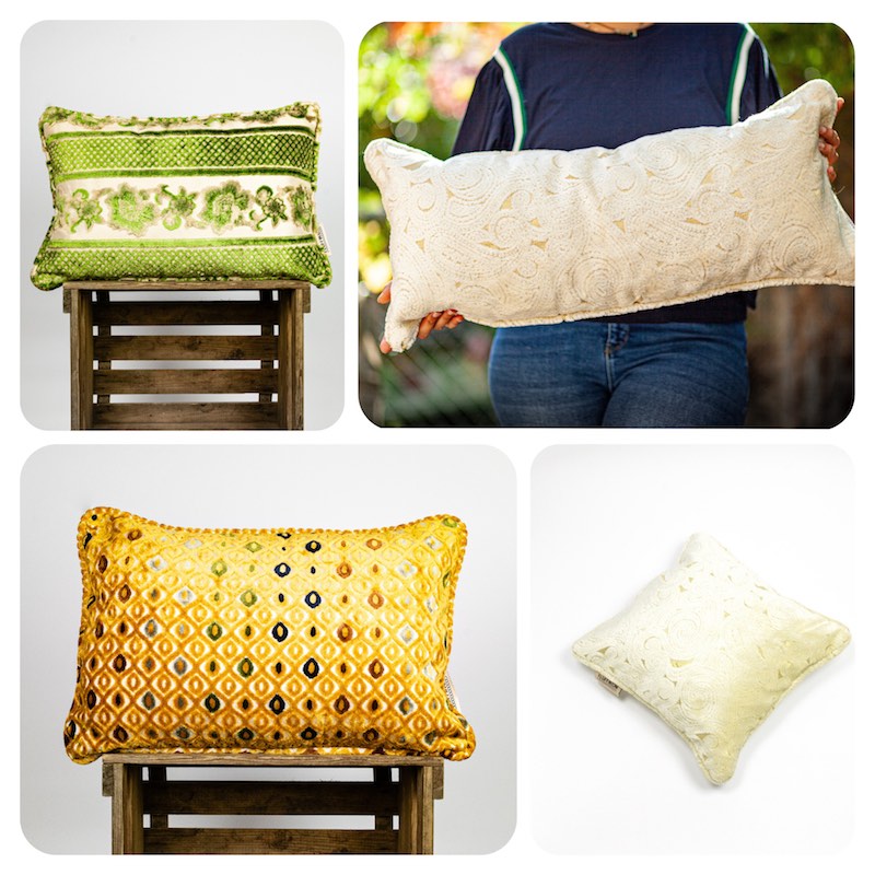 Four Fluffikon decorative throw pillows with unique moroccan fabrics. Green rectangular velvet pillow, beige lumbar velvet pillow, mustard yellow rectangular velvet pillow and square beige velvet pillow. 