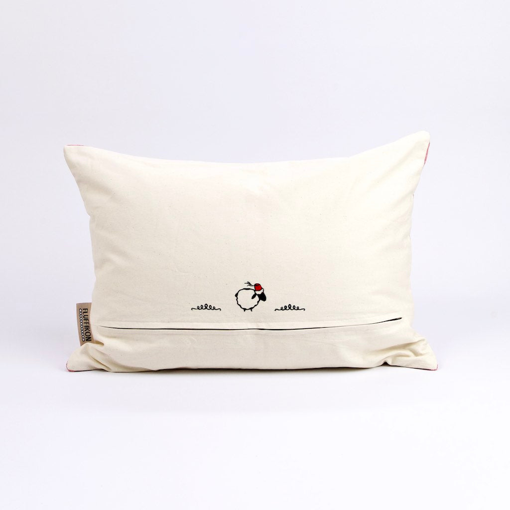 Beige Rückseite mit Fluffikon Logo eines rosa pinken Fluffikon Sofakissens. 