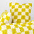 Three Beni Ourain with yellow and white checkered patterns are shown. The pillows are made from wool and look very fluffy.