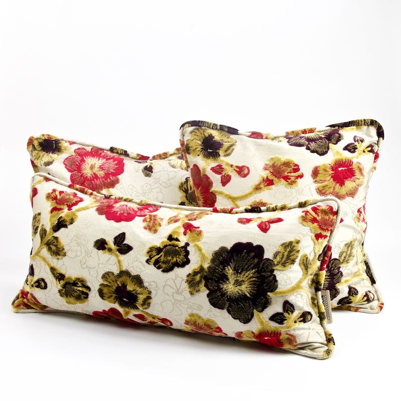 Two summertime throw pillows with flowers. It is a typical Moroccan pillow design.