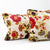 Zoom on two Fluffikon summer throw pillows with flower motif.