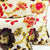 Zoom on two Fluffikon summertime throw pillows with floral motif.
