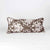 Brown Fluffikon XXL cushion standing in front of white background.