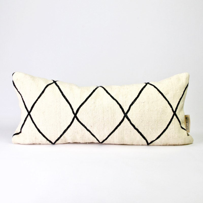 Black and white Fluffikon Kilim pillow. The lumbar pillows dimensions are 30x70 cm.