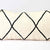 Zoom on Fluffikon Kilim pillow standing in front of white background