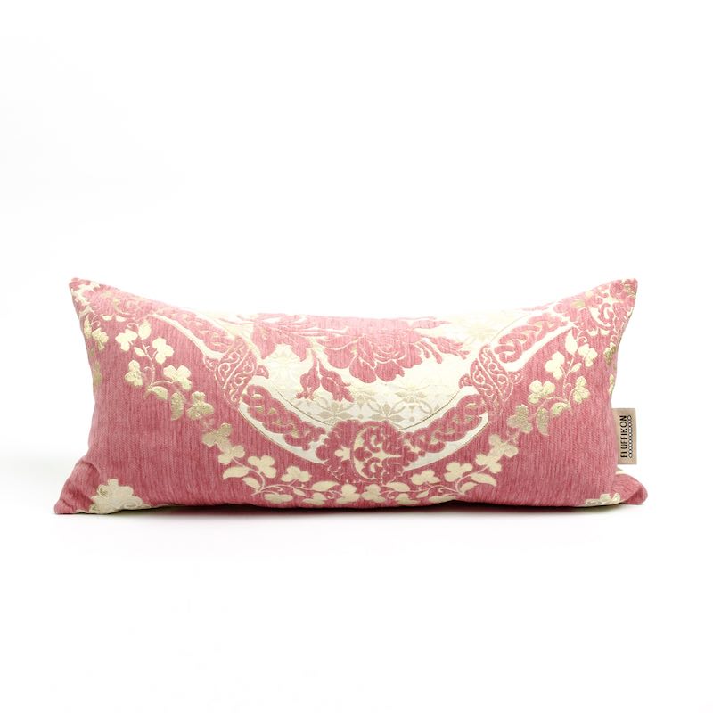 Blush pink Fluffikon lumbar pillow in size 35x70 cm. The pillow has a traditional Moroccan pattern made from golden flowers.
