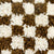 Detailed zoom on wool texture of earthly brown checkered Fluffikon Berber pillow.