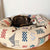 Cat Tacco curled up in hr new Fluffikon customized Kilim rug dog bed.