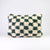 Checkered Moroccan wool pillow in size 40x60 cm. The pillow is standing in front a white background.