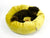 Dog in yellow dog bed made from velvet with moroccan patterns.