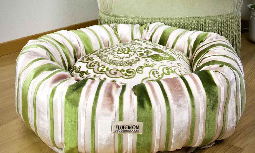 Green Fluffikon dog bed in a living room.