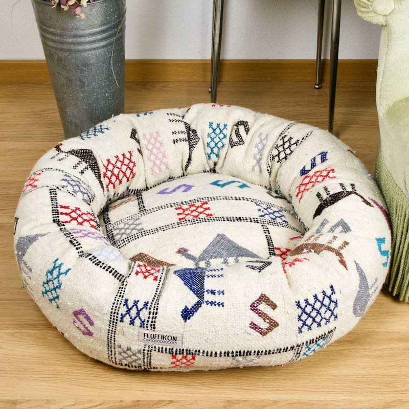The customized Fluffikon wool dog bed that is made from a Moroccan wool Kilim rug.